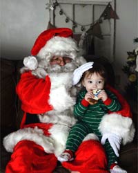 professional santa suit with boy eating cookie