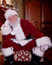 velvet santa suit sitting