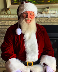 velvet santa suit with fireplace sitting